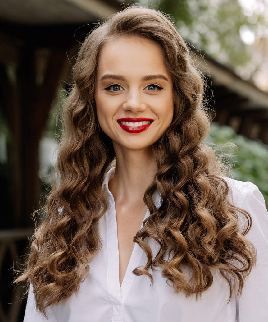 Long Hairstyle With Tight Curls And Deep Side Part