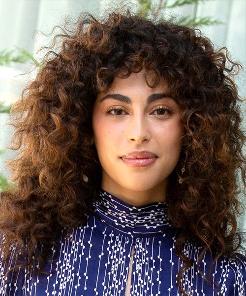 Mina El Hammani Long Curly    Brunette  Hairstyle with Side Swept Bangs  and Light Brunette Highlights