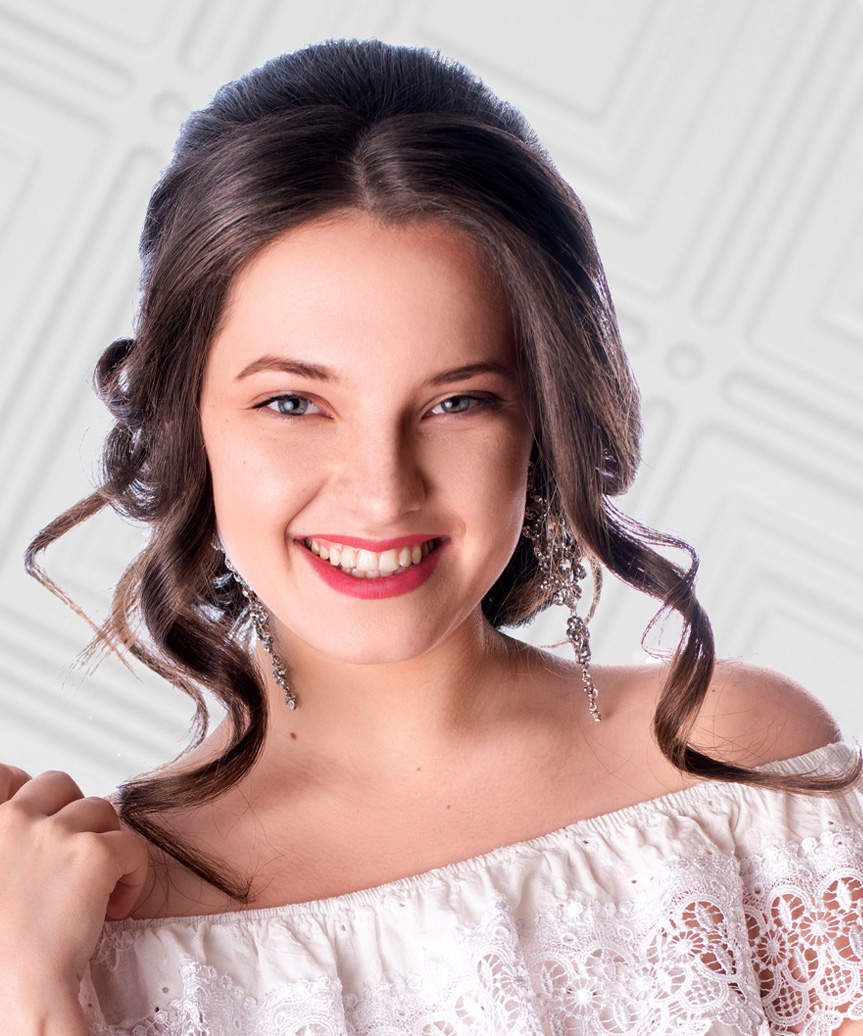 Curled Updo Hairstyle With Face-Framing Bangs